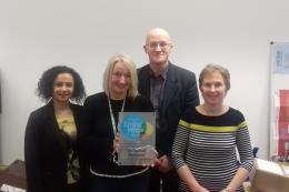 Unlimited Potential Staff posig with their Living Wage Plaque 2018